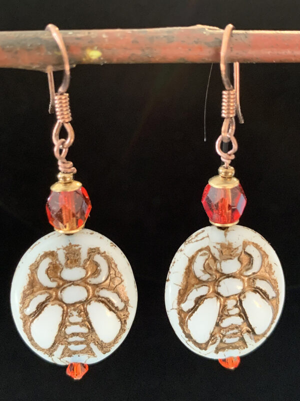 Earrings: Czech glass with gold bee imprint, copper finish ear wires