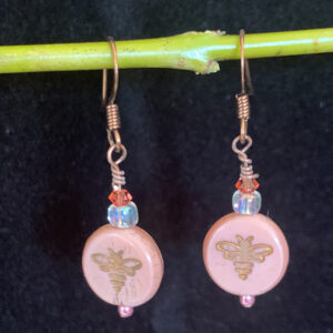Earrings: Austrian crystals and Czech glass stamped with gold bee bee. Shades of peach, orange, iridescent clear, copper finish ear wires