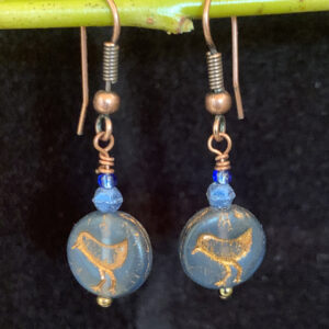 Earrings: Austrian crystal and Czech glass with bird imprint. Shades of translucent royal blue, copper finish ear wires