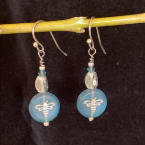 Earrings: Austrian crystal and Czech glass with bee imprint. Shades of translucent turquoise and clear, silver finish ear wires