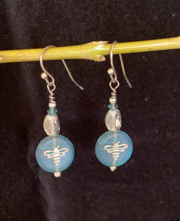 Earrings: Austrian crystal and Czech glass with bee imprint. Shades of translucent turquoise and clear, silver finish ear wires