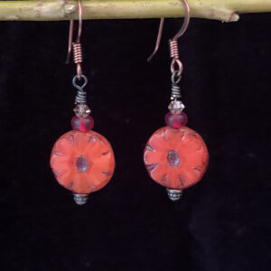 Earrings: Austrian crystals, Czech glass flower. Shades of orange, red and clear, copper finish ear wires